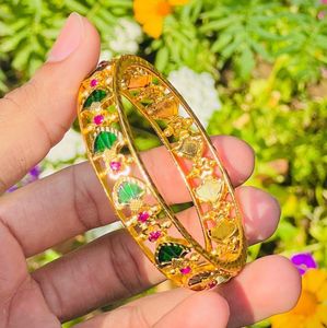 Elegant Gold Bangle with Green and Pink Stones