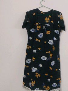I am selling a black cotton mini dress.