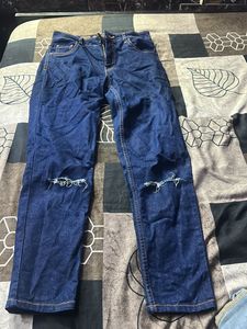 Ripped Knee Jeans