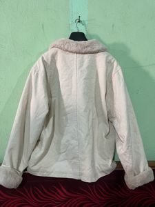 beige jacket with a faux fur collar and cuffs.