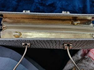 A brand new sparkly gold clutch