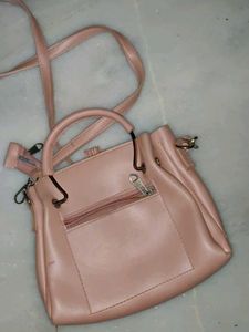 Pink Handbag with Pom Po