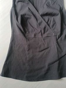 Black Sleeveless Surplice Top