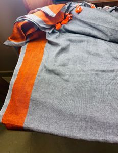 Black orange cotton blend saree with pompoms