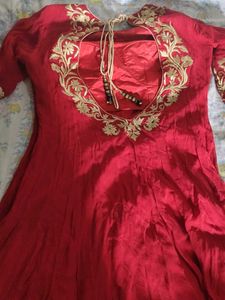 a good conditioned red embroidered gown or frock s