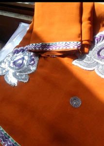 Elegant Orange Saree with Silver Embroidery
