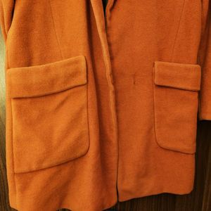 orange statement coat 🧥