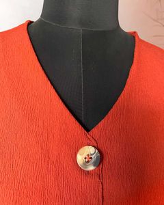 Rust Orange Peplum Top