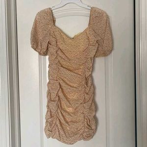 nude floral ruched mini dress with puff sleeves