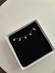 Gold Tone Crystal Charm Necklace