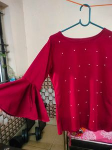 Red bell sleeve top