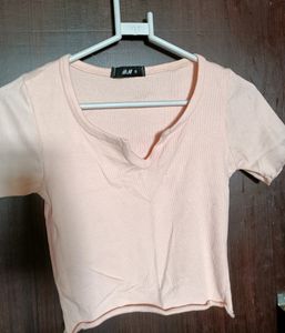 Combo of SSS black bootcut trousers and H&amp;M peach top