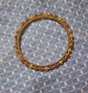 Elegant Gold Bangle with Colorful Bead Accents