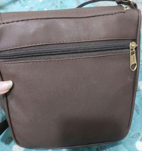 BRAND NEW SLING BAG.