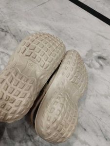 Beige Crocs with Charms