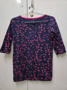 A Navy Blue Shirt With Pink Printed Flowers