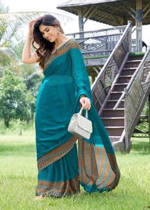 Elegant Teal Saree with Geometric Border