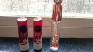 2 nivea cherry lipbalm and 1 glitter lip gloss