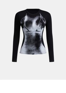 long-sleeve fitted top with a bold, Illusion