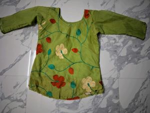 Green Embroidered short kurta top.