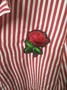 Striped Peplum Top with Rose Detail