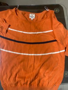 again orange broad neck top