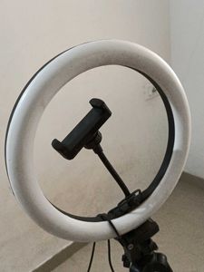 Silver Camera Tripod With Ring Light