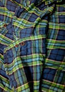 Stylish boys&#39; shirt with an attached hoodie.