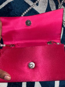 Elegant Pink Clutch with Pearl Strap