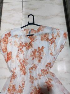 It&#39;s a frock orange White Colour