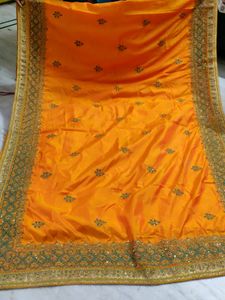orange fancy saree - best saree for farewell, reception or night events