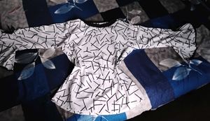 🤍✨Price Drop! Peplum Top - Geometric Print