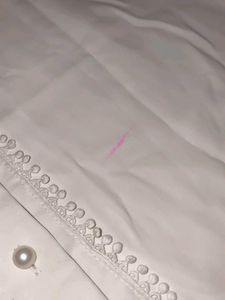 A White Shirt With Pearls