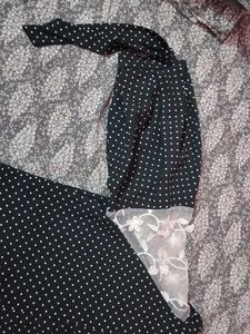 A Black Polyster Top With White Dots Nd Classic .