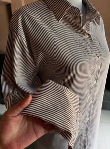 BROWN DRESS WITH RUFFLE HEM