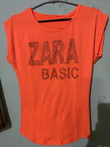 Soft Fabric,Cute Orange Bold Colour Top With Topography Print,medium In Size Bust Size -32, Can Pair It With Black Pant Or Dark Blue Jeans