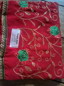Elegant Red Saree with Gold & Green Embroidery