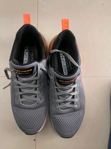 Walk comfortably in grey Skechers