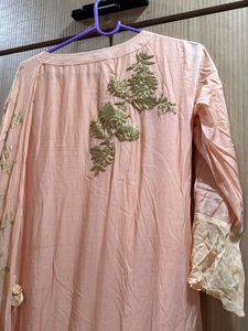 peach gown with cowl and attached drape