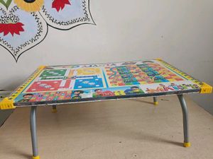 Kids/adults study table and ludo playing.