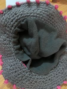 Handmade Crocheted Hat with Floral Embellishment