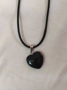 Black Heard Shaped Pendant And Faux Leather Chair