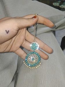 A beautiful earings and mangtika