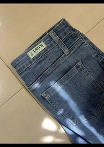 SKINNY DARK WASH RIPPED JEANS