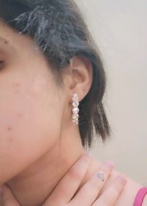Pair of earring with gold touch and stone
