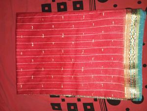 Red Is The Saree And Blue Blouse Piece