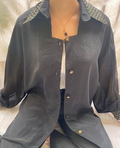 Black Shirt with quilt detail on sleeve