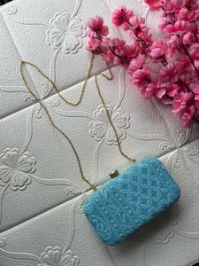 Sky blue chikankari clutch with sling belt