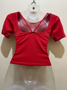 top features a V-shaped strap design at the back