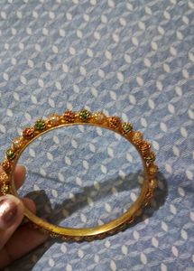 Elegant Gold Bangle with Colorful Bead Accents